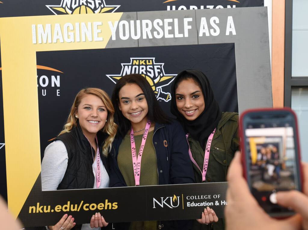 Three young women posing for a photo